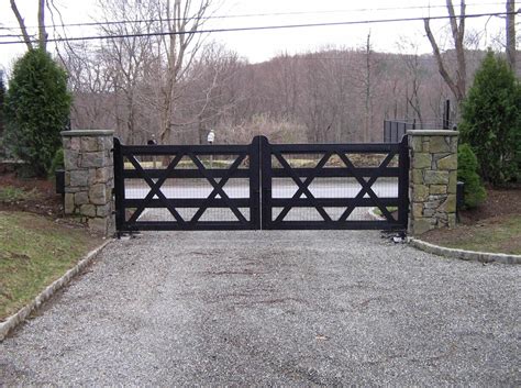Lucas equine builds entrance gates from a variety of high quality materials. A transitional or updated farmhouse wooden driveway gate ...