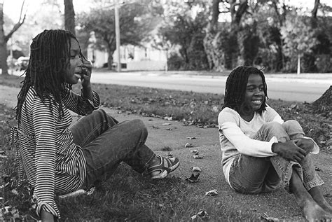 Two Black Girls Laughing On The Sidewalk By Stocksy Contributor Gabi