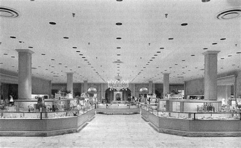 An Old Photo Of A Store Filled With Lots Of Counter Space And People