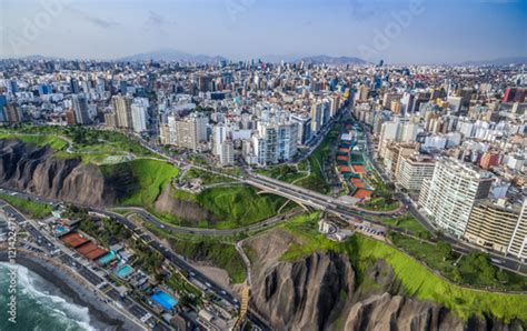 Panoramic Aerial View Of Miraflores Town And Lima City At Back Ground