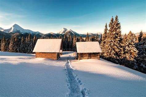 Wooden Huts In Winter Mountains On Sunrise Stock Photo Image Of