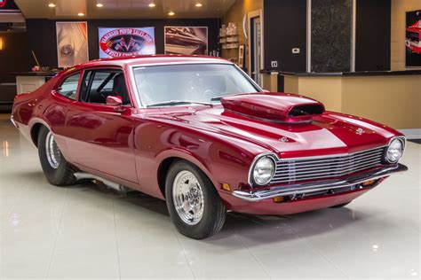We're looking at a 1971 ford maverick grabber in red paint. 1970 Ford Maverick | Vanguard Motor Sales