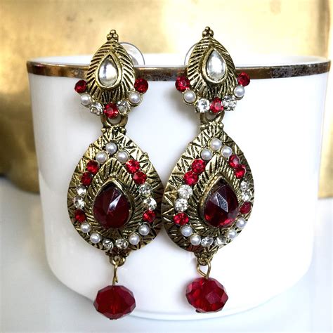 Red Chandelier Earrings With Gold Tone Finish Rhinestones