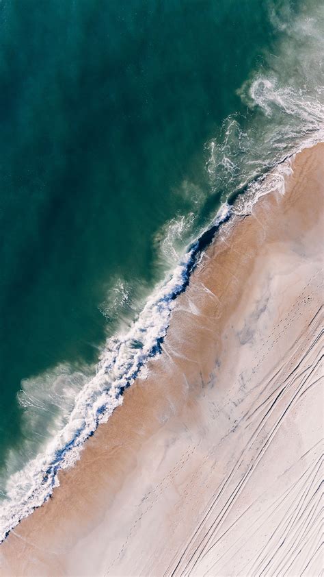 Download Wallpaper 2160x3840 Ocean Aerial View Surf Sand Foam