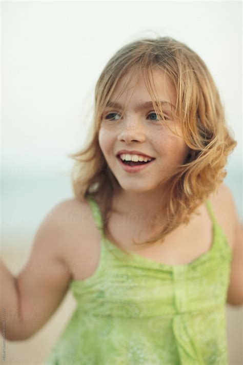Close Up Portrait Of A Young Blonde Girl Smiling By Stocksy