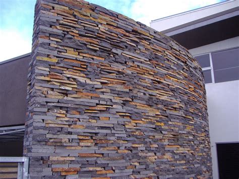 Rustic Bluestone Stackedstone Along A Curved Wall On The Entrance To