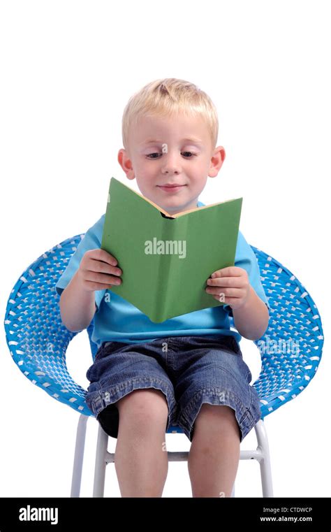 Little Boy Reading A Book Isolated On White Background Stock Photo Alamy