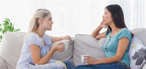 two women talking on couch2 | Kentucky Fertility Institute
