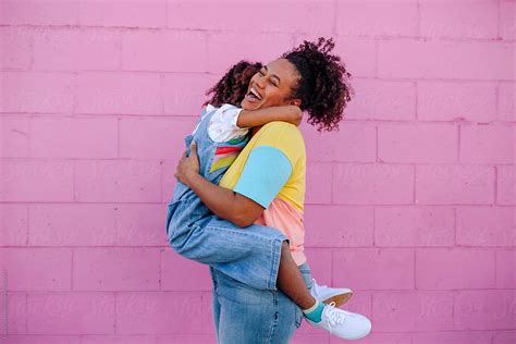 Joyous Mom Hugging Daughter By Stocksy Contributor Erin Brant Stocksy