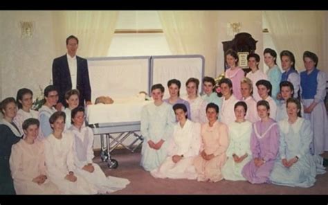 Warren Jeffs And 21 Of His Wives Posing With His Fathers Corpse