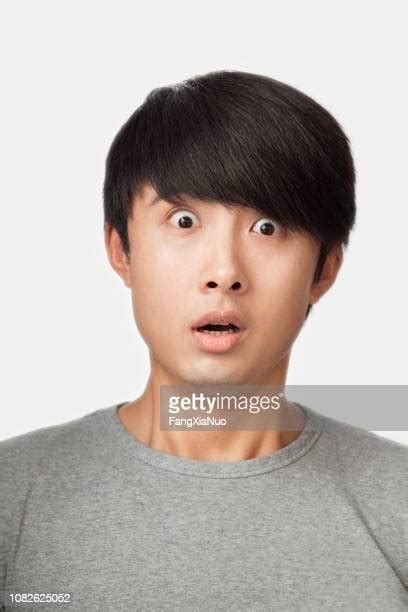 mouth open close up asian photos and premium high res pictures getty images