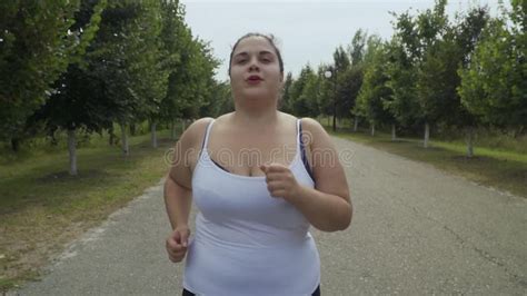Fat Girl Runs Along The Road Stock Video Video Of Girl Highfed 127411293