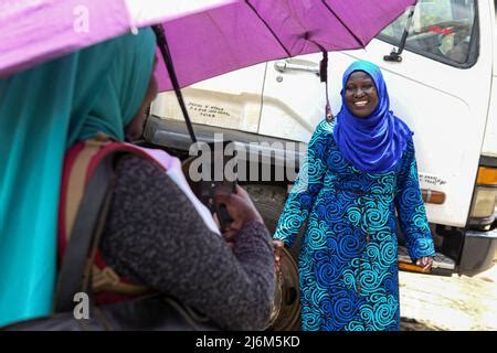 Kenyan Women Take Photos Of Themselves Along Digo Road In Majengo