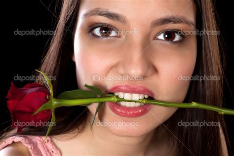 Red Rose In Her Mouth — Stock Photo © Klanneke 18762585