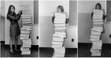 Margaret Hamilton Poses Next To A Huge Stack Of Code She Wrote By Hand