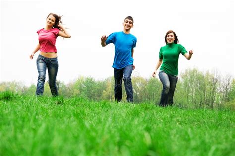 Happy Friends Jumping Stock Image Image Of Attractive 9132693