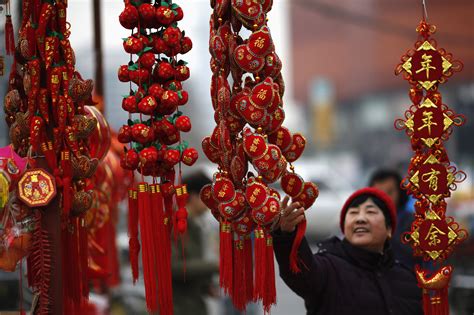 1st day of the chinese new year is 11 feb 1975 of the solar or gregorian calendar, year of the rabbit.later on in 2016 it is the horse and 2017 is chinese new year is important to the chinese because they are starting a new year.a new life. A Woman Looks At Traditional Decorations Celebrating For ...