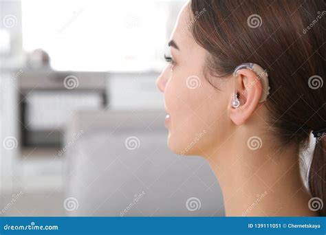 Young Woman With Hearing Aid Indoors Closeup Stock Image Image Of