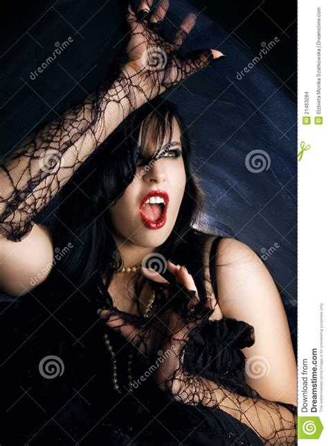 Female Vampire Wants To Bite A Man Stock Image