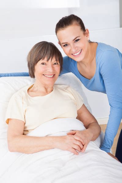 Portrait Of Happy Caregiver With Senior Woman Royalty Free Photo