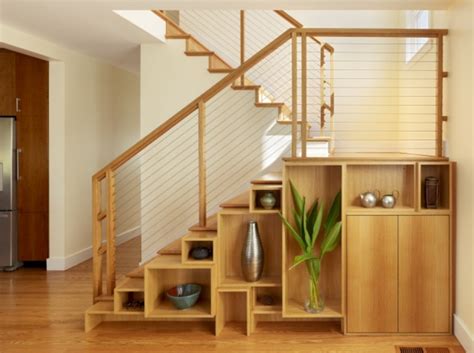 The form floating design creates room under the staircase for a small office. 15 Unusual Under stairs storage ideas and solutions