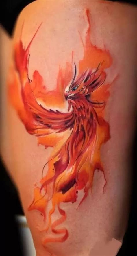 An Orange And Red Bird Tattoo On The Leg With Watercolor Splashes All