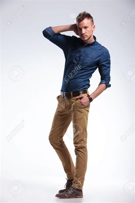 Full Length Portrait Of A Casual Young Man Posing With A Hand Stock