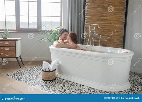 A Man And A Woman Having A Bath Together And Looking Enjoyed Stock