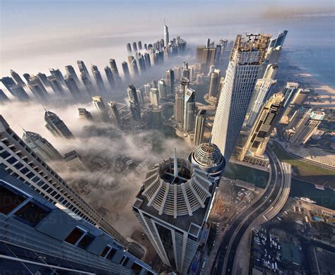 Aerial View Of Cityscape With Skyscrapers Above The Clouds In Dubai