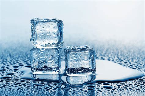 Watericeice Cubemelting Stock Photos Pictures And Royalty Free Images