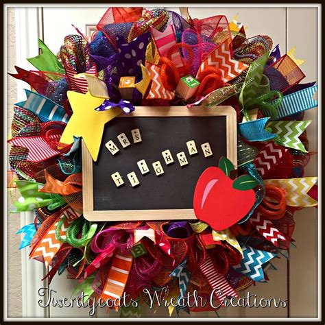 A Colorful Wreath With An Apple Star And Word Blocks On It That Says