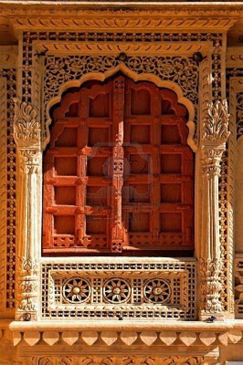 An Intricately Carved Window In The Middle Of A Building