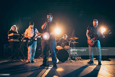 Rock And Roll Band Performing Hard Rock Music On Stage High Res Stock
