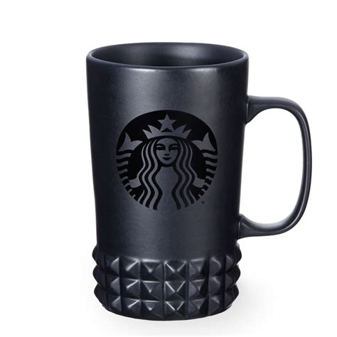 A Ceramic Coffee Mug With A Matte Black Body And Studded Details Part