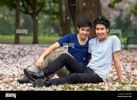 Relaxing Outdoors Together Cute Young Gay Asian Couple Smiling