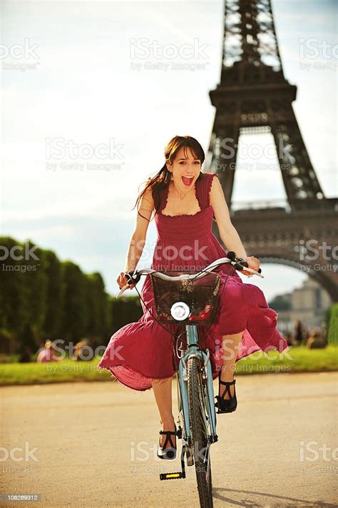 Young Woman Riding Bicycle In Park Eiffel Tower Paris France Stock