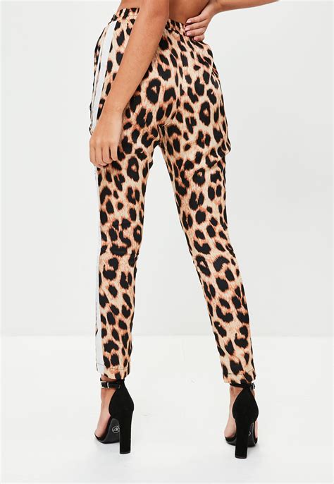 lyst missguided brown leopard print side stripe joggers in brown