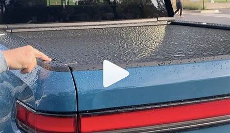 Watch the R1T tonneau cover roll up automatically (with water on top