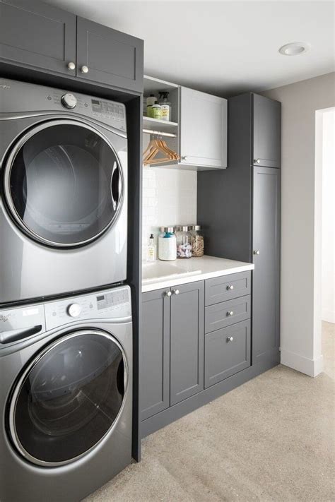 Create instant storage using wooden craft crates spray painted to the color of your i love how this blogger created floating shelves between her cabinets to instantly boost her storage space and add warmth to her laundry room. Laundry Room Cabinet Ideas With Blue, Green and Gray ...