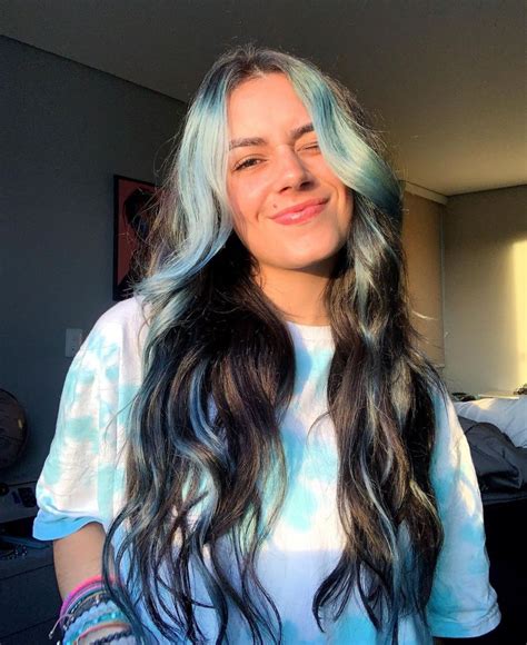 Pastel Blue Streaks And Bangs Hair Color With Waves Hairstyle