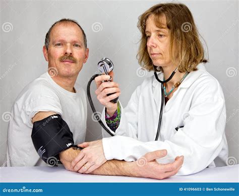 Doctor Checks Blood Pressure Of A Patient Stock Image Image Of