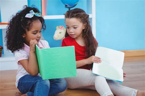 Premium Photo Cute Girls Holding Books