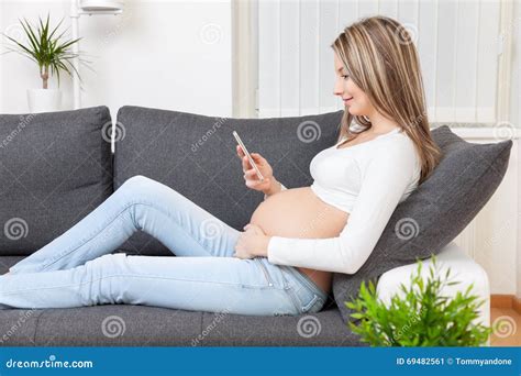 Beautiful Pregnant Woman Relaxing At Home Stock Image Image Of Motherhood Mobile 69482561
