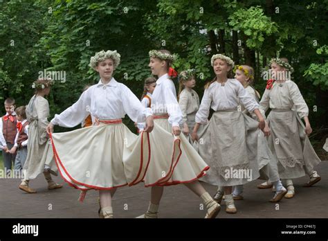 Latvia Folk Festival Girls In Traditional Costume As They Perform A