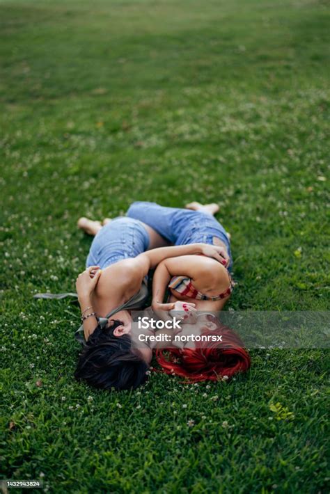 Photo Of A Two Lesbian Girls Spending Time Outdoor Together Laying On