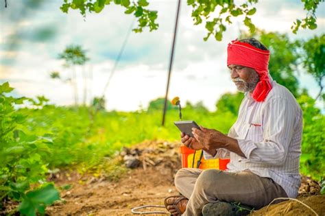 Premium Photo Indian Farmer Using Mobile Phone At Agriculture Field
