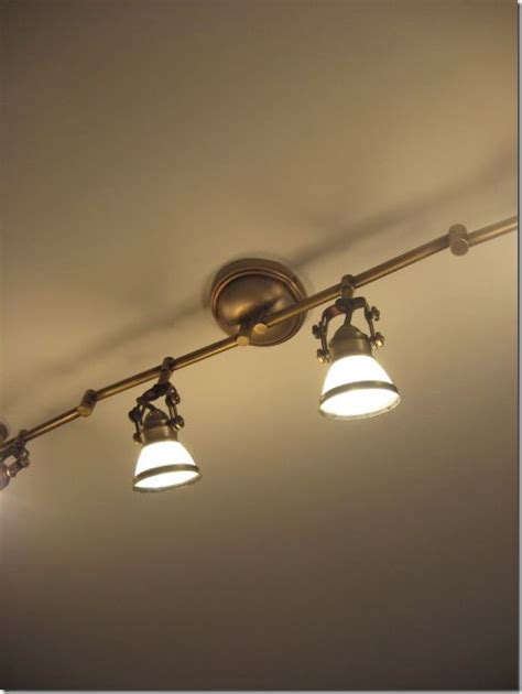 These lights have plastic grid grills covering them which are very old and outdated in appearance. Tour My Home | Track lighting kitchen, Cottage lighting ...