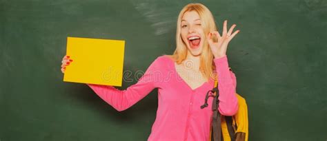 Excited Amazed Teacher Student Girl Holding Empty Faper For Product