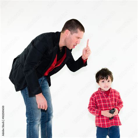 Portrait Of Angry Father Scolding His Son Pointing Finger Isolated On