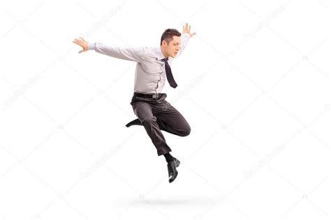 Young Businessman Jumping In The Air Stock Photo By ©ljsphotography